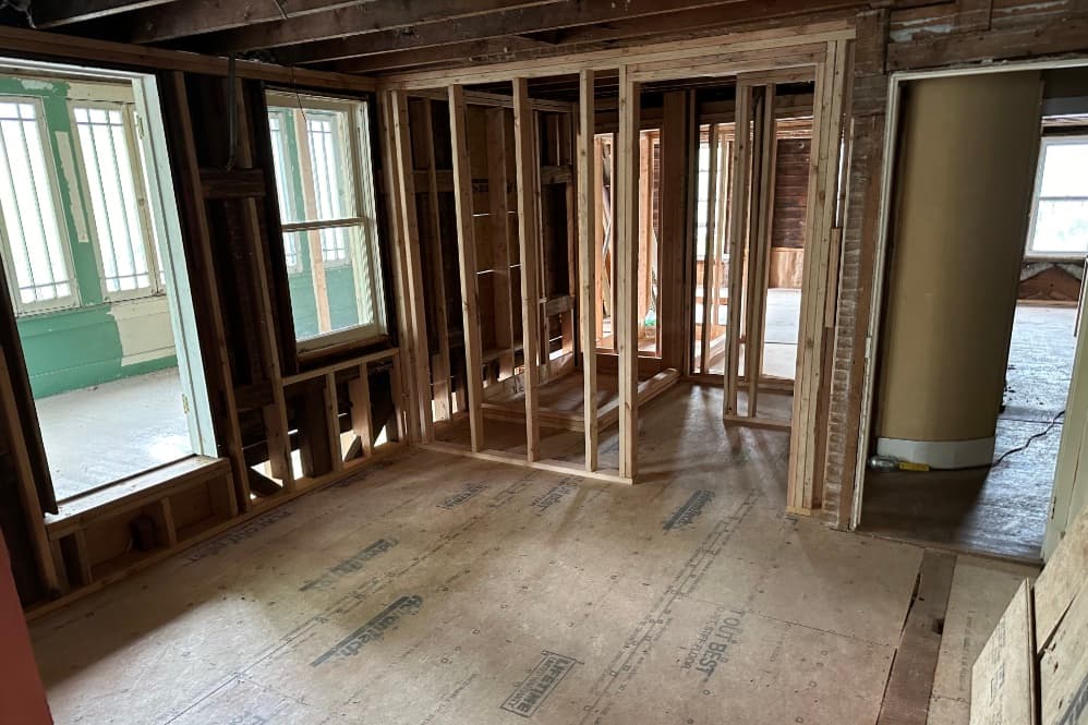 Interior of a partially framed home under renovation.